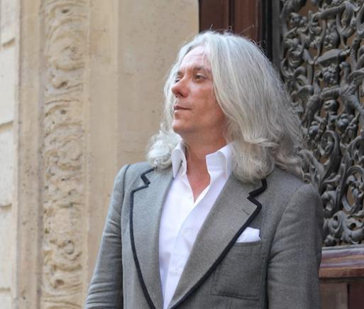 Parisian gentlemen wearing grey suit with white inner collared shirt