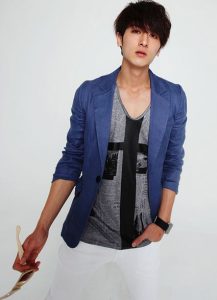 blue jacket over black and grey shirt