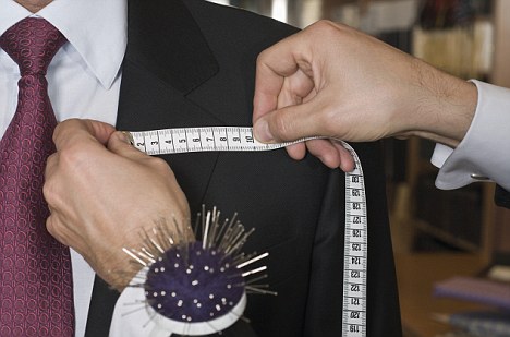 Tailor Working on Suit --- Image by © Chengas/Corbis