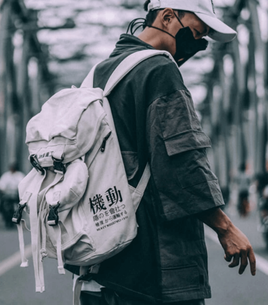 Man wearing a white Japanese Kanji Backpack